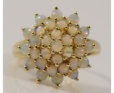 A 9ct gold opal cluster ring, 18mm cluster, M 1/2, 3.5g