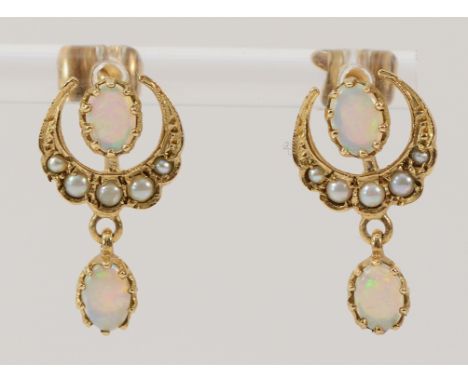 A pair of 9ct gold seed pearl and opal earrings with scroll backs, 2.6g Condition:Full UK hallmarks, all pearls and opals pre