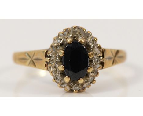 A 9ct gold diamond and sapphire cluster ring, K, 1.7g
