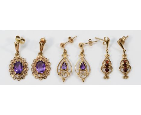 Two pairs of 9ct gold and amethyst drop earrings with scroll backs, together with a pair of 9ct gold garnet drop earrings, 5.