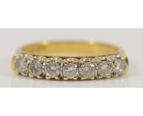 An 18ct gold brilliant cut diamond seven stone ring, K, 3.3g Condition-Full UK hallmarks, stated 0.50ct dia, no chips to any 