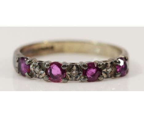 A 9ct white gold ruby and diamond half eternity ring, L, 2g