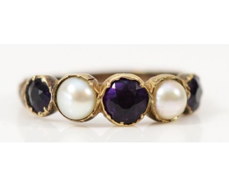 An unmarked 9ct gold cultured pearl and amethyst dress ring, hallmarks missing due to resizing or wear, L 1/2, 1.7g