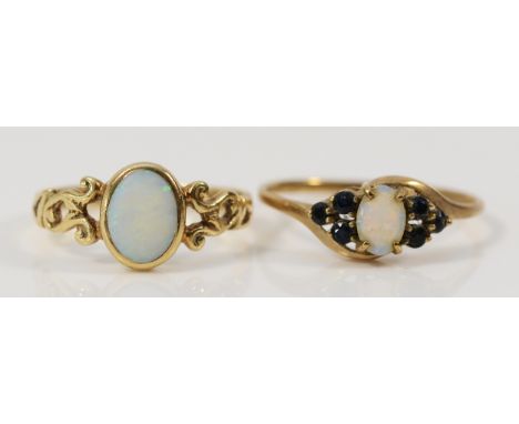 A 9ct gold opal solitaire ring, M, together with a 9ct gold opal and blue gemstone dress ring, P, 2.9g