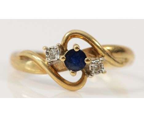 A 9ct gold diamond and sapphire cross over ring, K 1/2, 1.8g