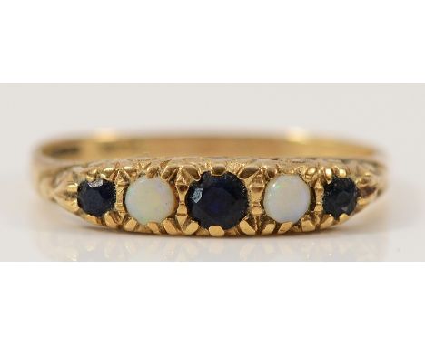 A 9ct gold sapphire and opal five stone carved claw ring, Q, 1.5g
