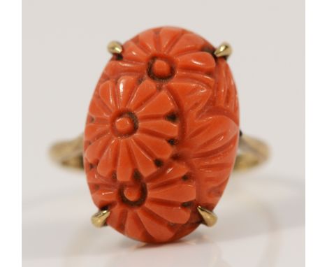 A 9ct gold carved coral dress ring, L, 3.3g