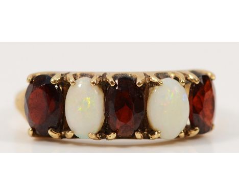 A 9ct gold opal and garnet five stone ring, K, 2.4g