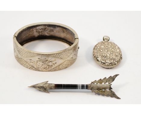 An 800 silver hinged bangle with floral bird pattern, an unmarked silver floral locket, 38mm, an unmarked silver and agate ar