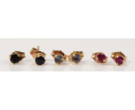 Three pairs of 9ct gold earrings with scroll backs, to include tanzanite, sapphire and ruby, 1.1g