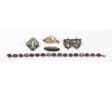 A sterling silver paste bracelet, 18.5cm, a silver "Baby" brooch, Chester 1914, a silver floral horseshoe brooch, Chester 190