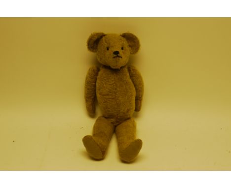 A French 1920s Teddy Bear, With dark blonde mohair, black boot button eyes, pronounced muzzle, black stitched nose and mouth,