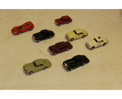 Tri-ang Minic Motorway 00 Gauge Vehicles comprising red Austin A40 (roof supports damaged), black and white Police Jaguars (b