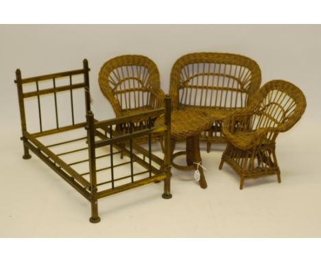 A Doll's Brass Bed Stead, With foot and head board- 19in long, together with a doll's wicker work sofa, armchairs and circula