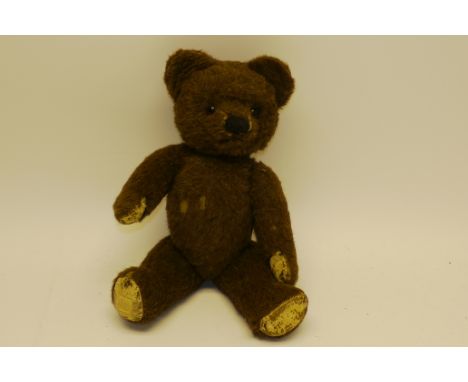 1950s Chad Valley Teddy Bear, With brown alpaca plush, orange and black glass eyes, stitched nose and mouth, swivel head, joi