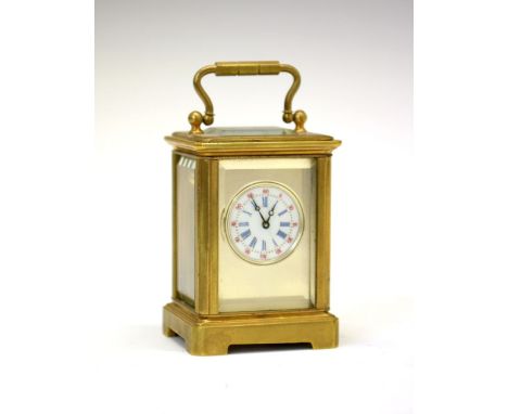 Early 20th Century brass-cased 'Mignonette' carriage clock, the 2cm diameter circular dial with blue Roman numerals and red A