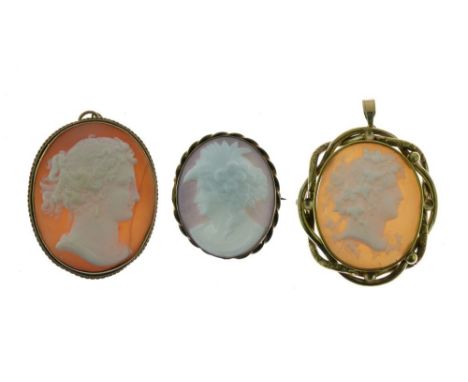 Two gilt metal shell cameo pendants, each with typical carved female profile portrait, largest 42mm excluding suspension loop