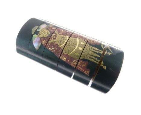 Japanese black-lacquered six-section inro, probably Meiji period, decorated in low relief and mother-of -pearl with a mounted