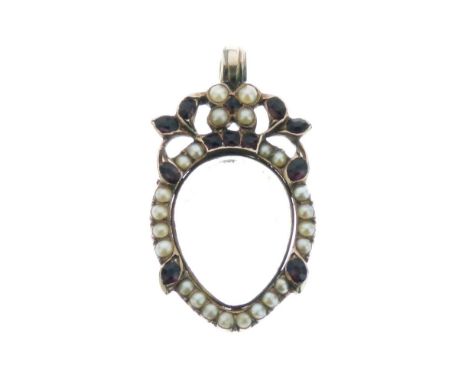 Victorian unmarked yellow metal, seed pearl and red stone mourning pendant, of teardrop design with hinged glazed cover for h
