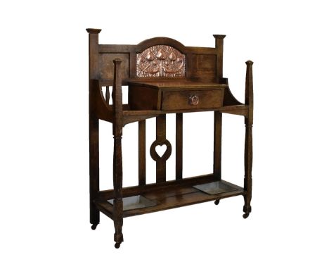 Early 20th Century Arts &amp; Crafts/Art Nouveau oak and copper hall stand, the break-arch back centred by a planished copper