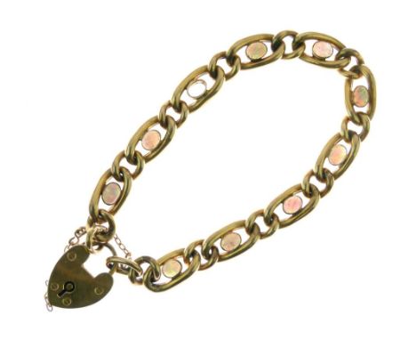 Early 20th Century 9ct gold curb-link bracelet, set with eight (of nine) opal oval cabochons, padlock hallmarked Birmingham 1