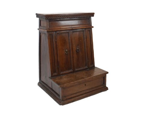 Early 19th Century Continental walnut prie-Dieu cabinet, probably Italian, the hinged cover with fluted frieze over a pair of