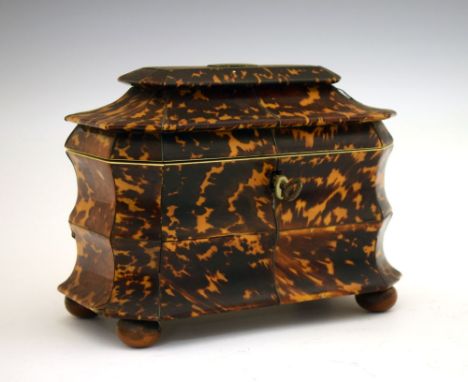Early Victorian blonde tortoiseshell tea caddy, of bombé design, the hinged stepped cover of canted oblong form enclosing two