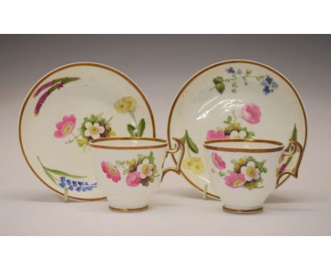 Rare pair of early 19th Century Swansea Pottery tea cups and saucers, attributed to William Pollard, decorated with dog-roses
