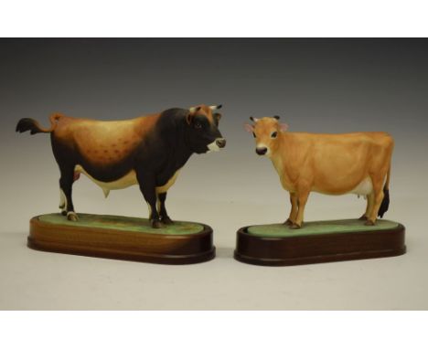 Royal Worcester model 1961 bone china 'Jersey Cow', together with model 1965 'Jersey Bull', both on wooden mounts, 20cm high 