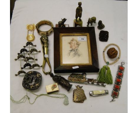 Rosewood framed portrait, brass nutcracker, a Tsuba, elephants, etc.