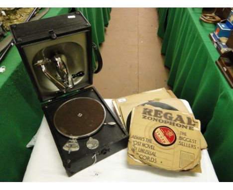 A Decca Junior portable record player with assorted 78 rpm records.