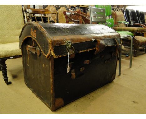 A Victorian leatherbound dome top trunk