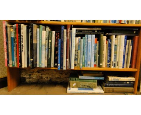 Shelf of books on fly fishing etc