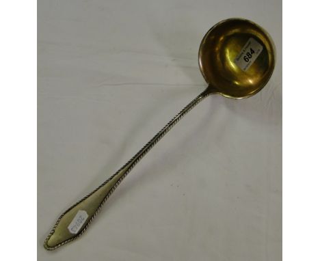 An 800 silver ladle with shaped edge & gilded bowl, 6.6 ozs