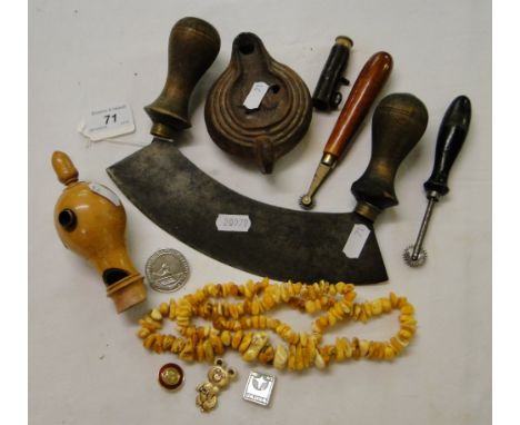 A herb chopper, oil lamp, necklace, etc.