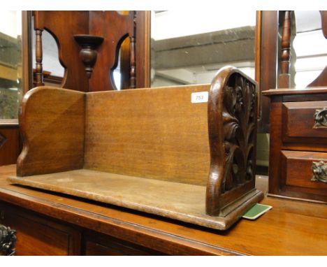 A carved oak table top book trough.