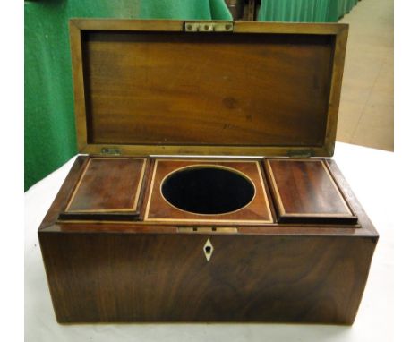 A Mahogany tea caddy with fitted interior