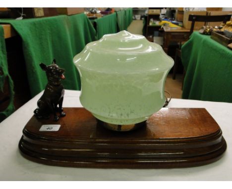 A French oak mounted table lamp with spelter dog.