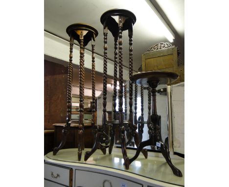 Pair of reproduction mahogany jardiniere stands and a tripod table, (3).