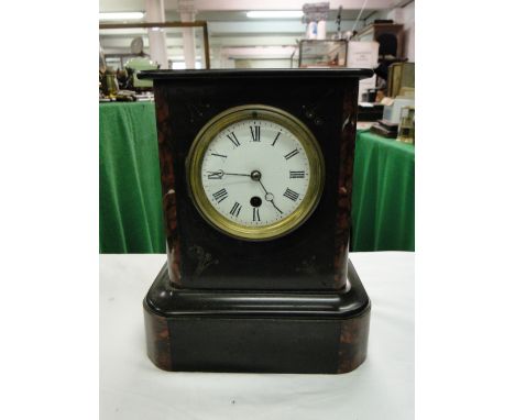A slate cased mantel clock.