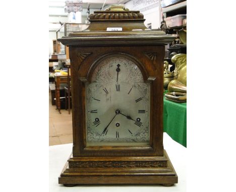 An oak cased 3 train mantel clock