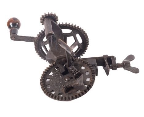 A bench mounted cast iron mechanical apple peeler, by C. E. Hudson, Leominster, Mass.Provenance:  The Christopher Hawkings Co