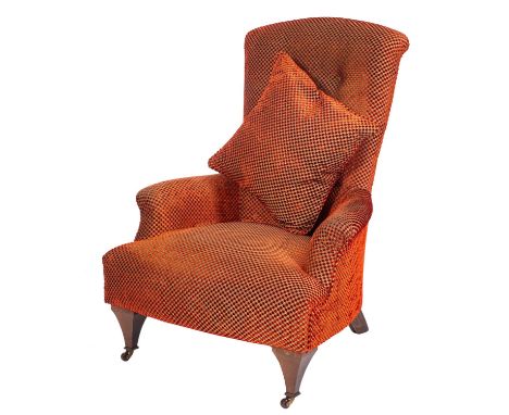 An Edwardian beech frame armchair, fully upholstered in a contemporary red chequer pattern embossed fabric, having a button d