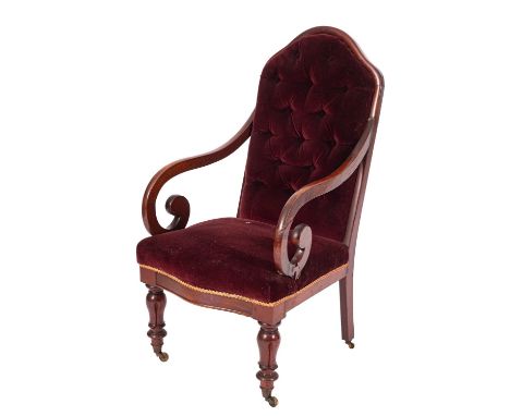 A Regency mahogany button-back upholstered open elbow chair, circa 1815, with arched back and scrolled arms; the serpentine f