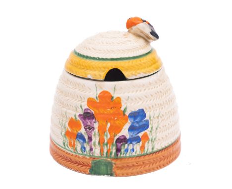 A Clarice Cliff Bizarre beehive honeypot and cover decorated in the 'Autumn Crocus' pattern, printed marks, circa 1932, 9cm [