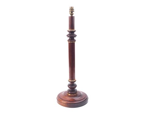 A mahogany and gilt-metal mounted columnar table lamp, later 20th century; with knopped and waisted shaft to a moulded circul