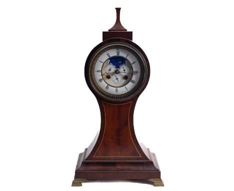 A balloon shaped late-Victorian mahogany moonphase mantel clock having an eight-day duration movement striking the hours and 