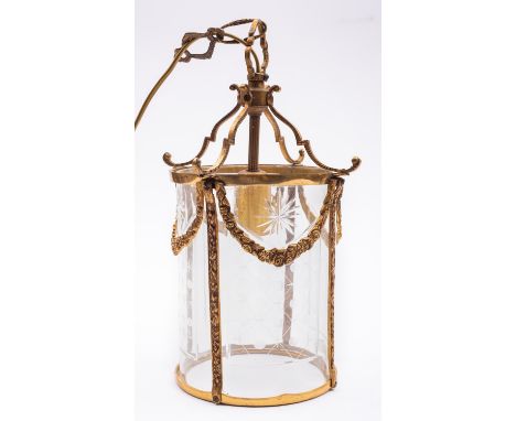 A gilt, brass and glazed ceiling lantern in 18th century taste, 20th century; of cylindrical form, the four bowed panes with 