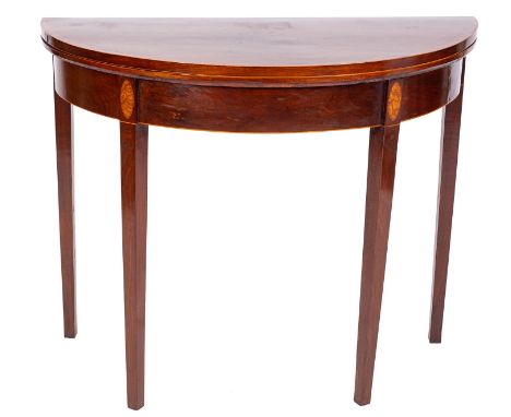 A George III mahogany and inlaid half round card table, bordered with boxwood and ebony lines, having a kingwood crossbanded 