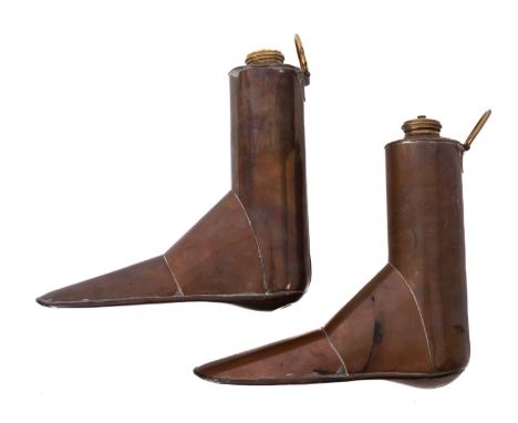 A pair of copper boot warmers, with brass screw tops and ring handles, 19cm x 19cm.Provenance:  The Christopher Hawkings Coll